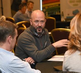Delegates Discussing Their Businesses